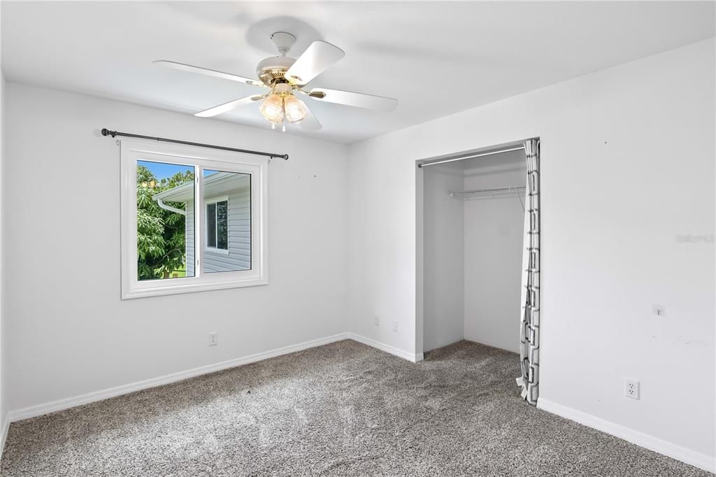 Bedroom with large closet and double window