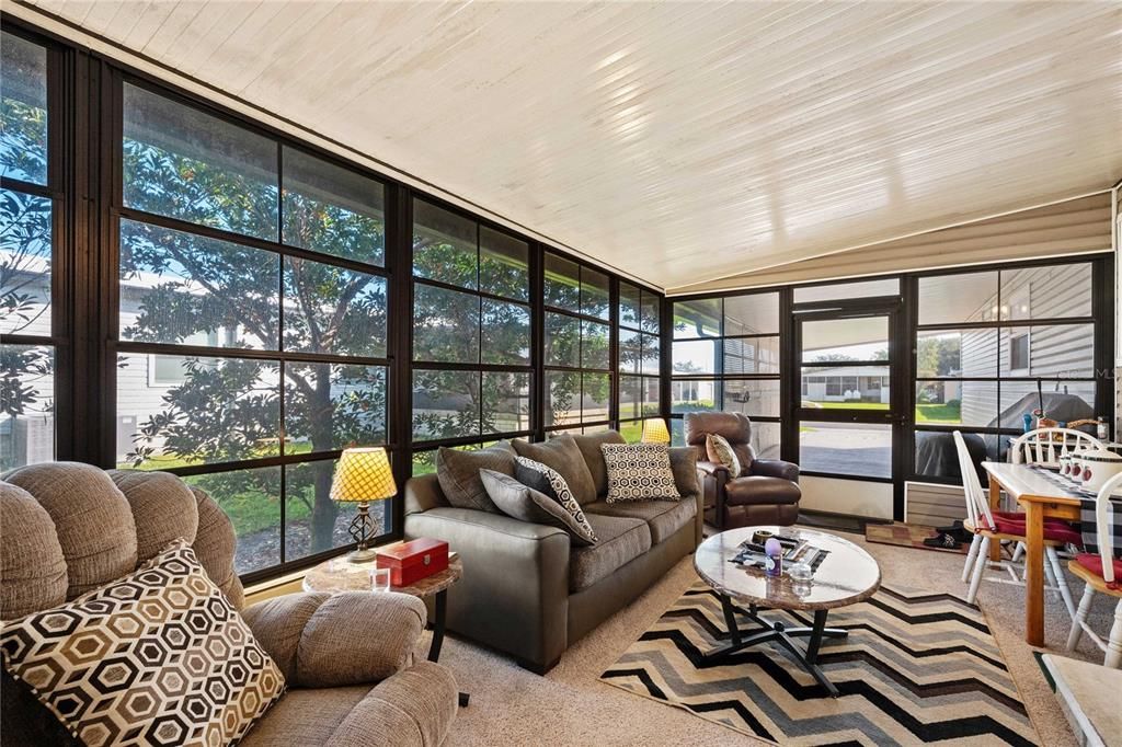 Enter off the carport into this Florida room which has heat and cooling.