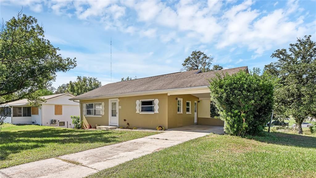 Front of house with carport