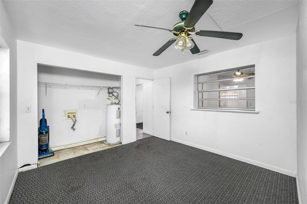 Primary Bedroom (With Large Utility Area for Full Size Washer and Dryer.)