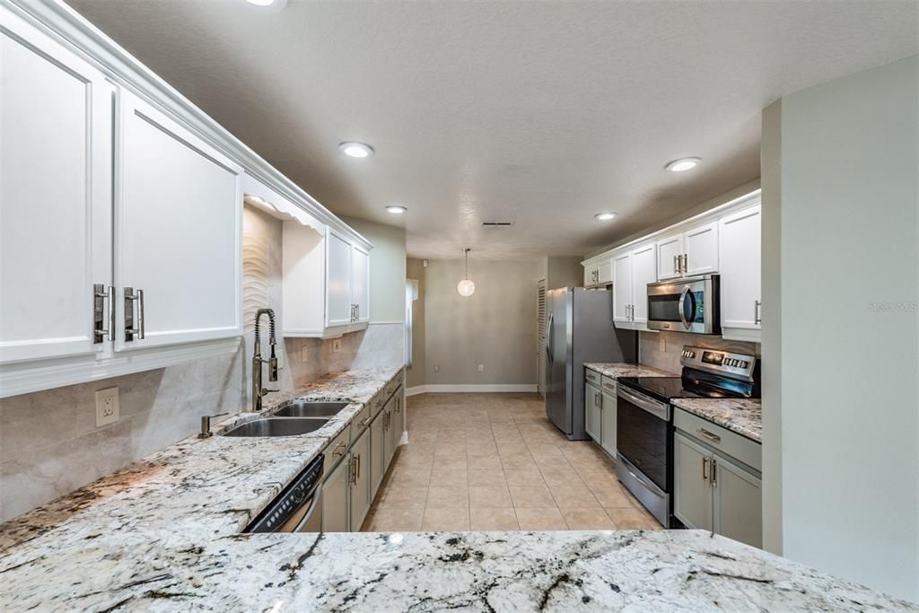 Gleaming GRANITE sets off the appliances with eat in breakfast nook too!