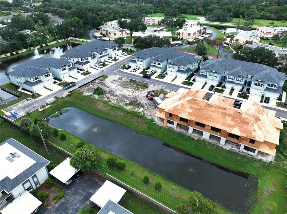 Back of building with view of over flow pond