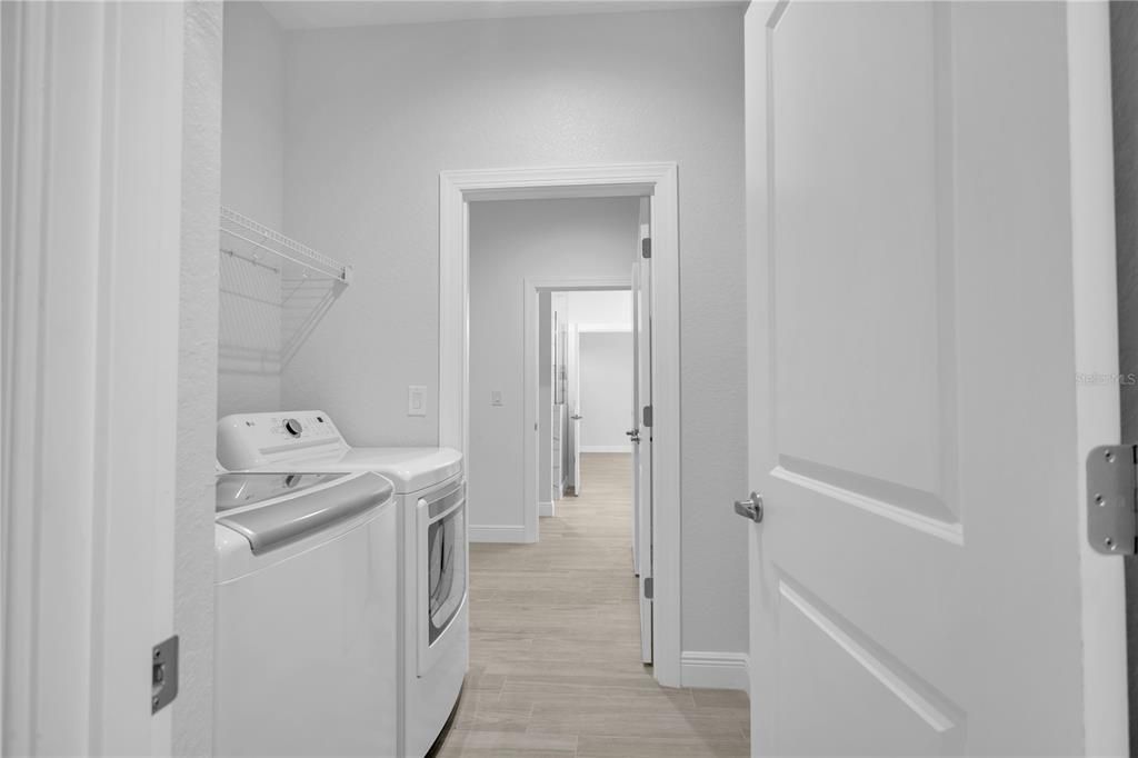 Laundry Room W/ Access to the Main Closet