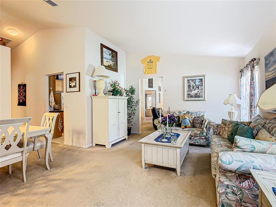 Entrance with a view of the living room and formal dining