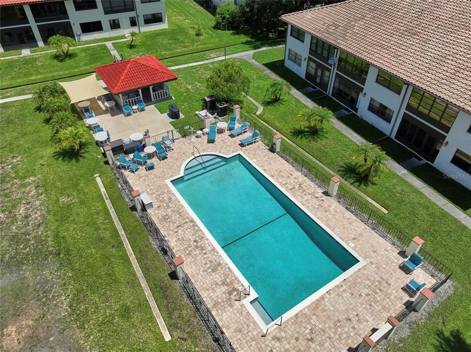 Community pool features paver deck