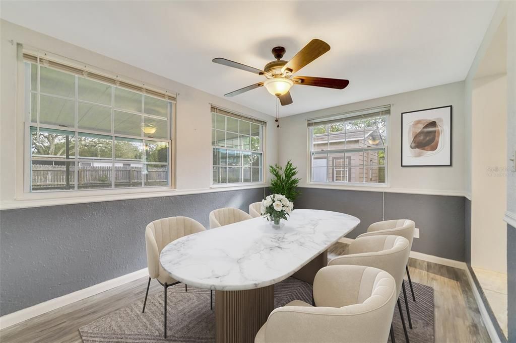 There are spacious living and dining areas on either side of the renovated kitchen...Virtually Staged.