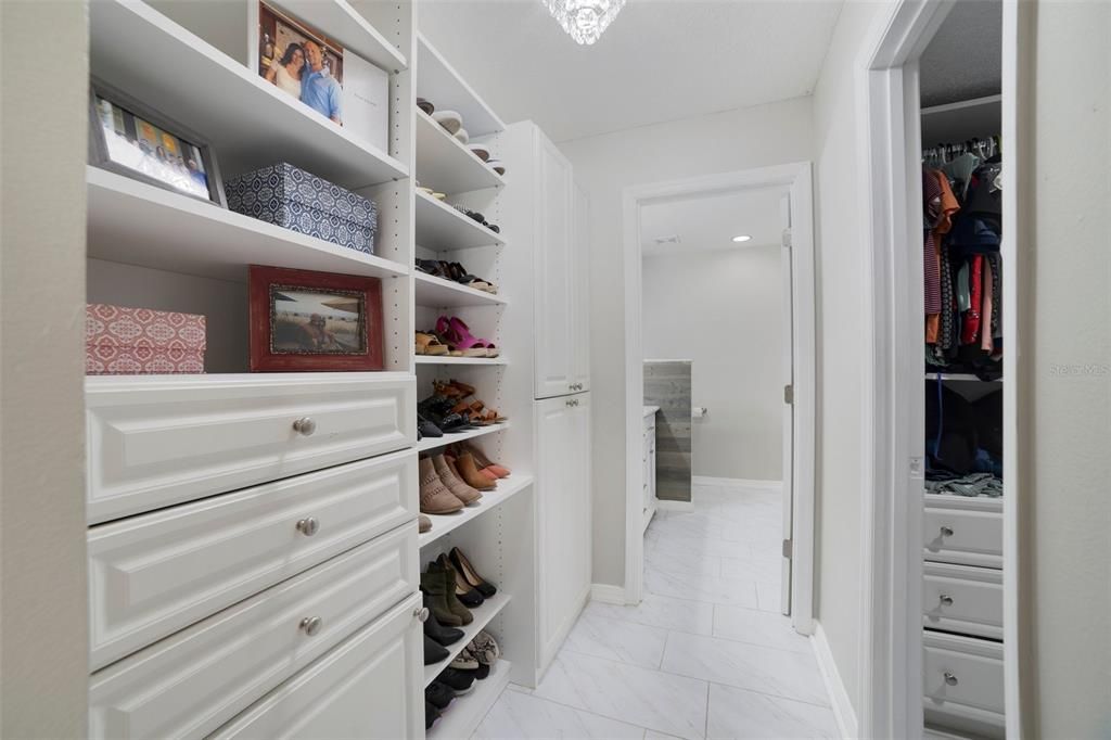 PRIMARY SUITE CUSTOM WALK-IN CLOSET.