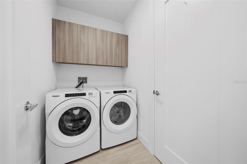 Laundry Room Located at entrance of the condo