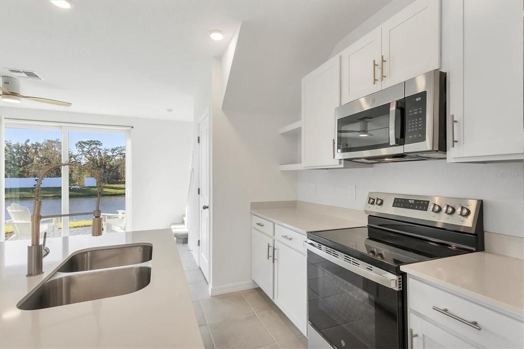 Quartz countertop, and matching stainless appliances!