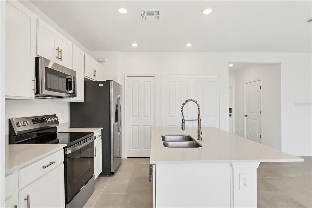 Quartz countertop, and matching stainless appliances!