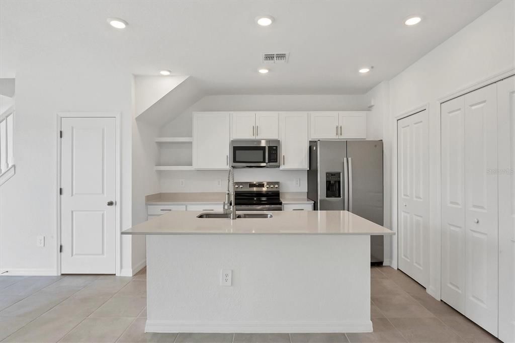 Quartz countertop, and matching stainless appliances!