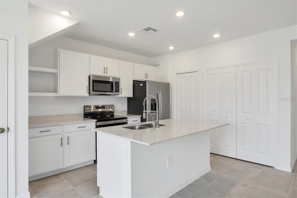 Quartz countertop, and matching stainless appliances!