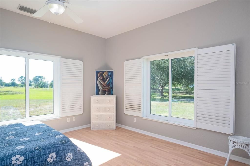 Guest Cottage Master Suite and plantation shutters.