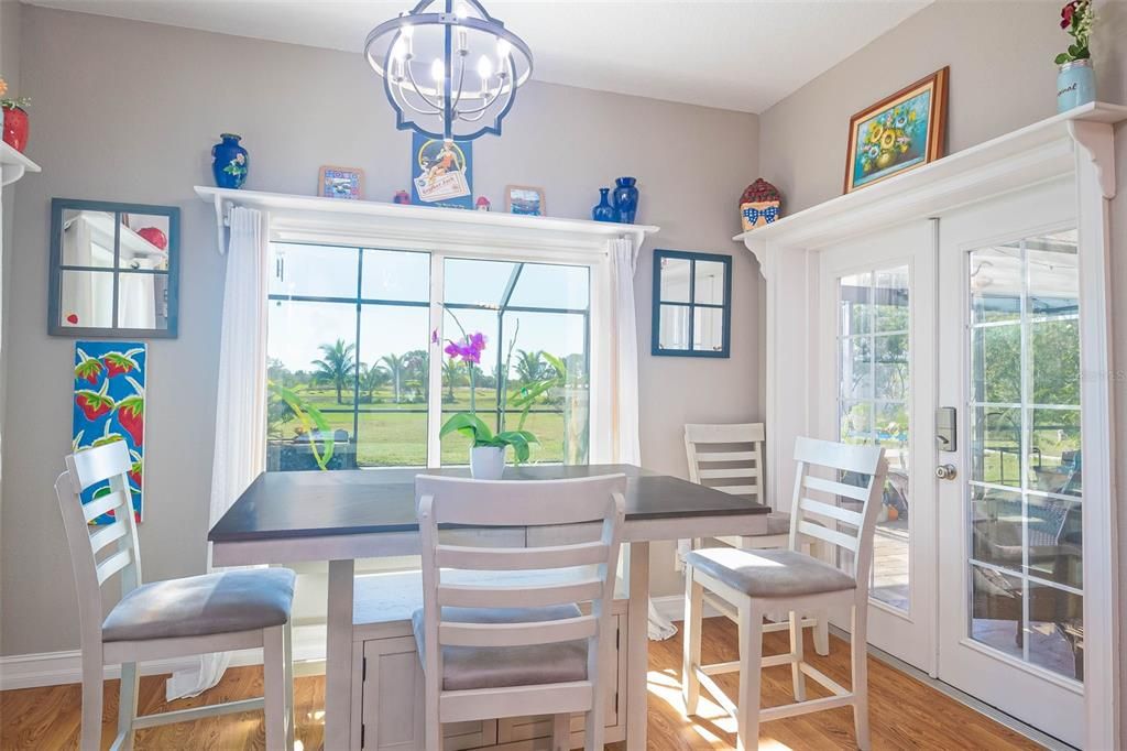 Breakfast room with double French doors leading to the covered patio.