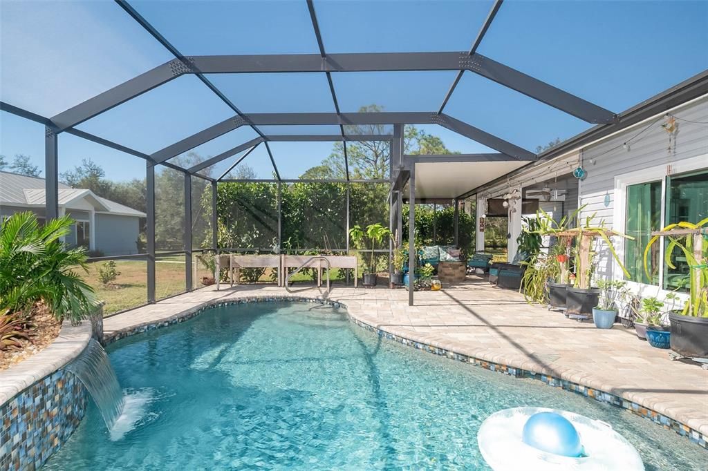 Saltwater pool and large pool caged patio.