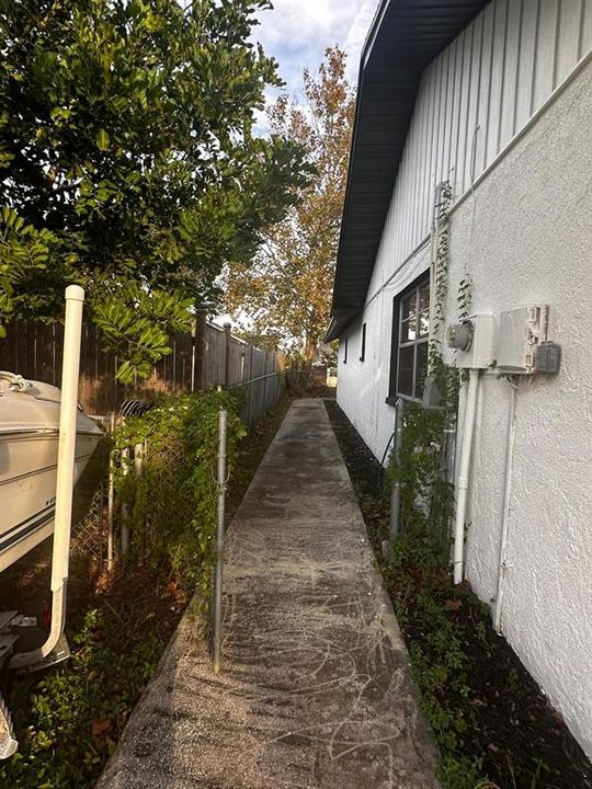 Left Side of Home with WalkPath all Around Home