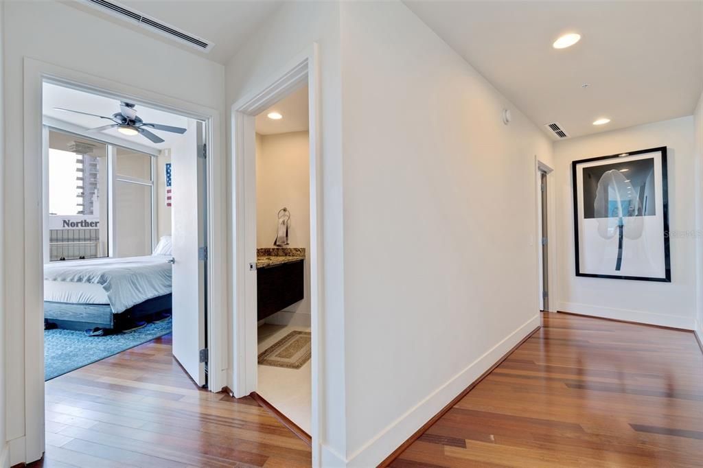 Guest Bedroom & Bathroom on the left, Master Guest ensuite down the hall - Downstairs