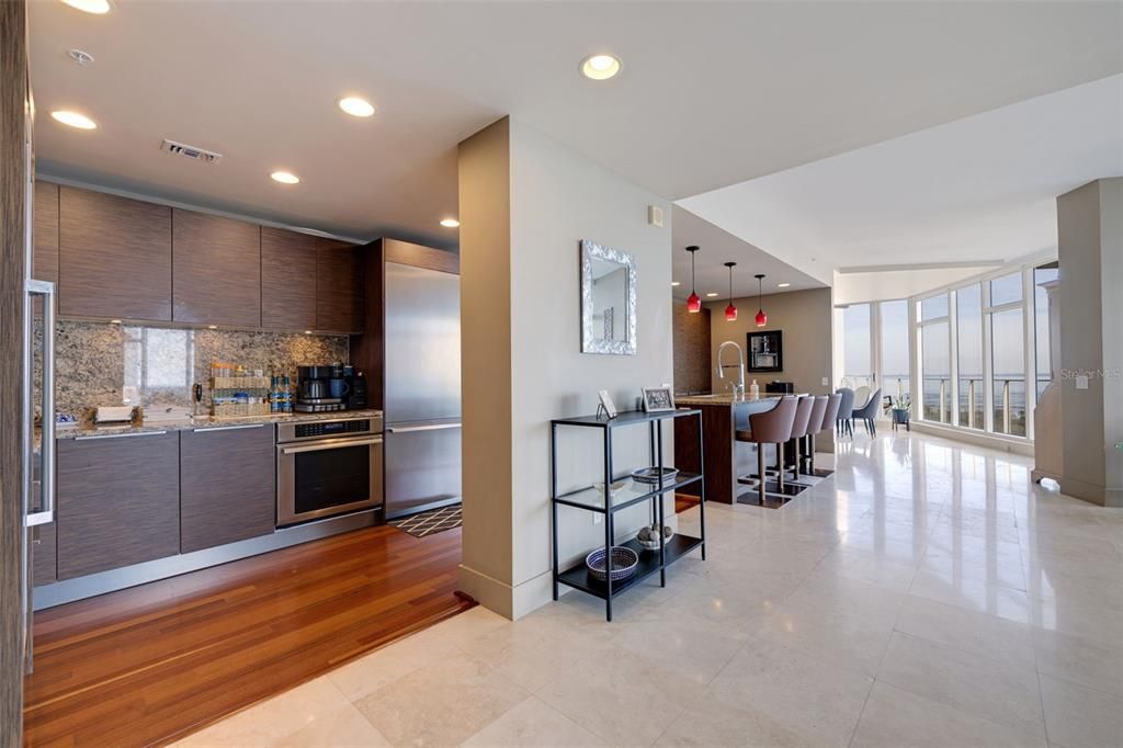 View of kitchen, with dining room at the far end