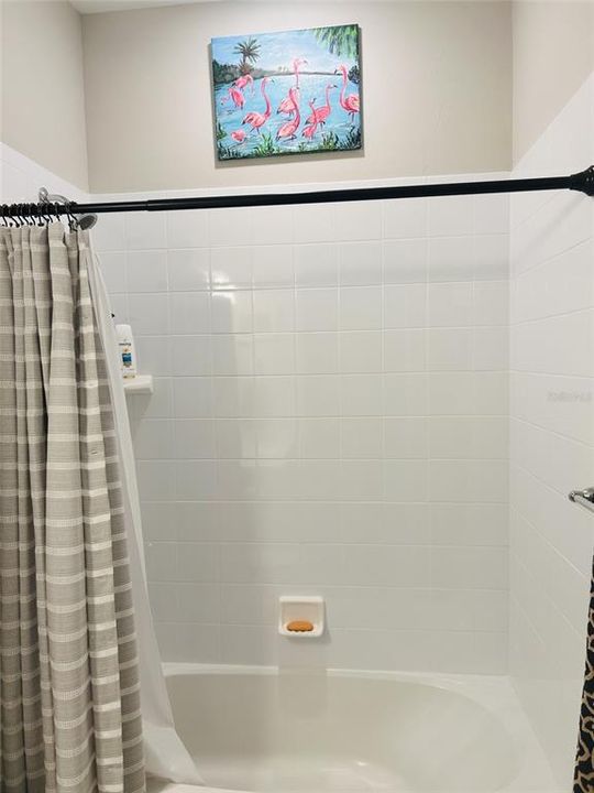 Tiled walls in shower tub in Guest Bath