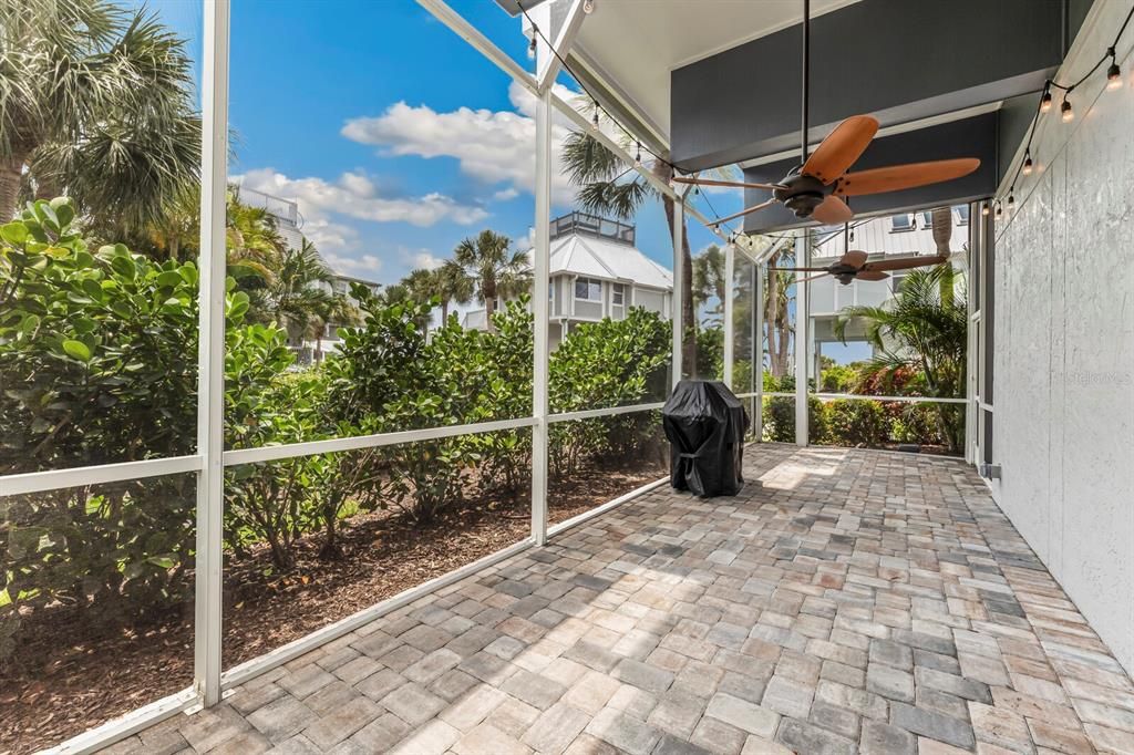 Spacious ground floor screened-in porch.  Great place to cook up fish and lounge around with your dogs! A wonderful upgrade from the original Village Home design!