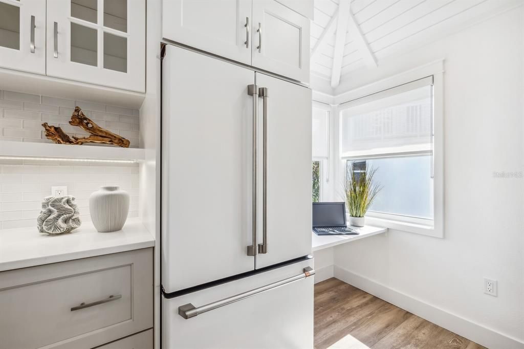 Expanded "corner" of kitchen is a costly and time consuming renovation that really "opens up" a Village Home kitchen! This improved space provides a laundry area and office nook (that could double as a folding space for laundry).