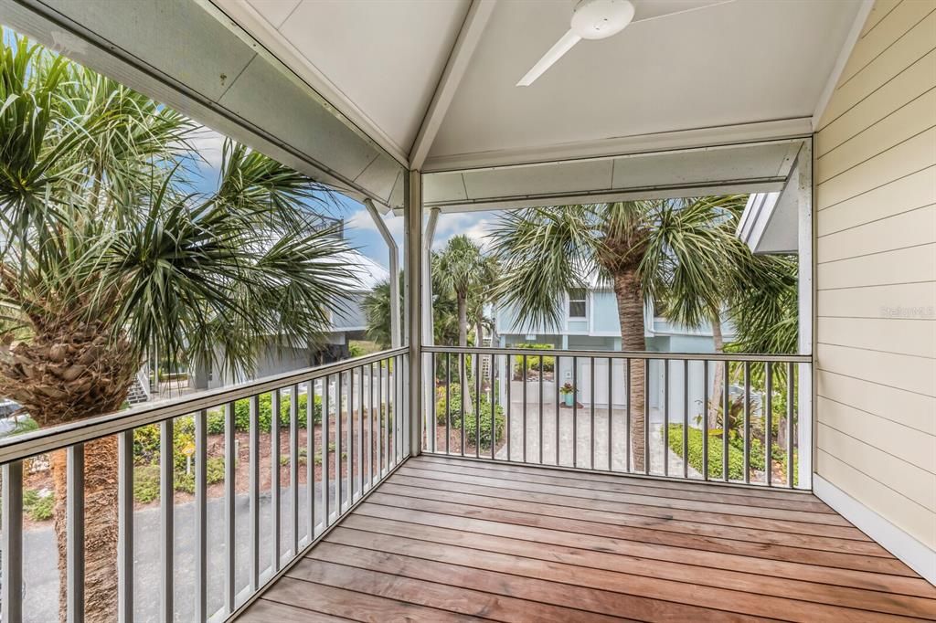 Private guest room screened-in porch renovated with shiplap walls and Ipe wood deck.