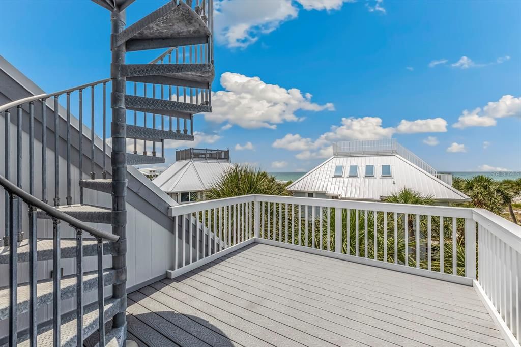 Outdoor deck accessible from second floor loft guest bedroom ensuite. Spiral staircase takes you to the roof top deck with panoramic views of Charlotte Harbor and the Gulf of Mexico!