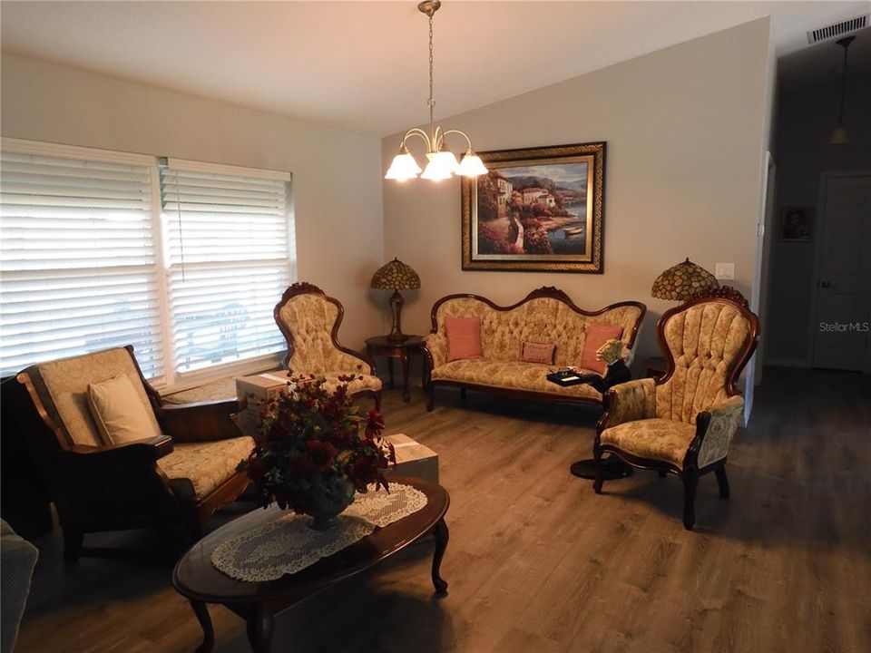 Spacious living room area, cathedral ceilings.