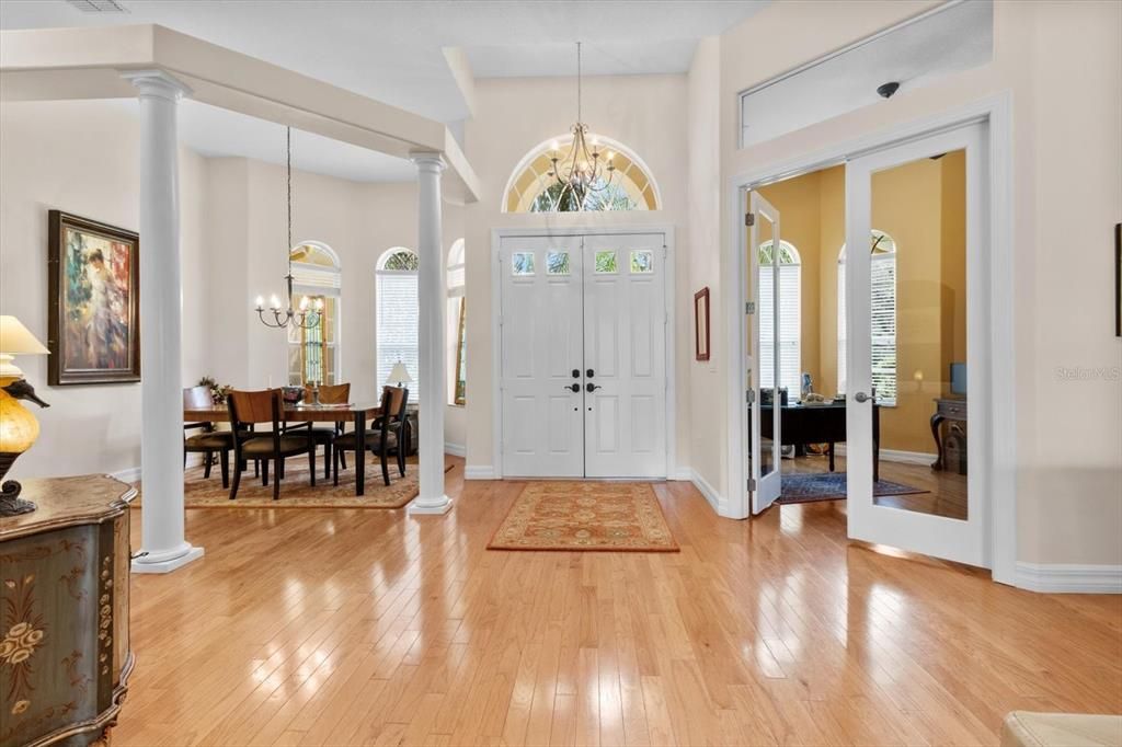 Inside front entrance with dining room and den/study on either side