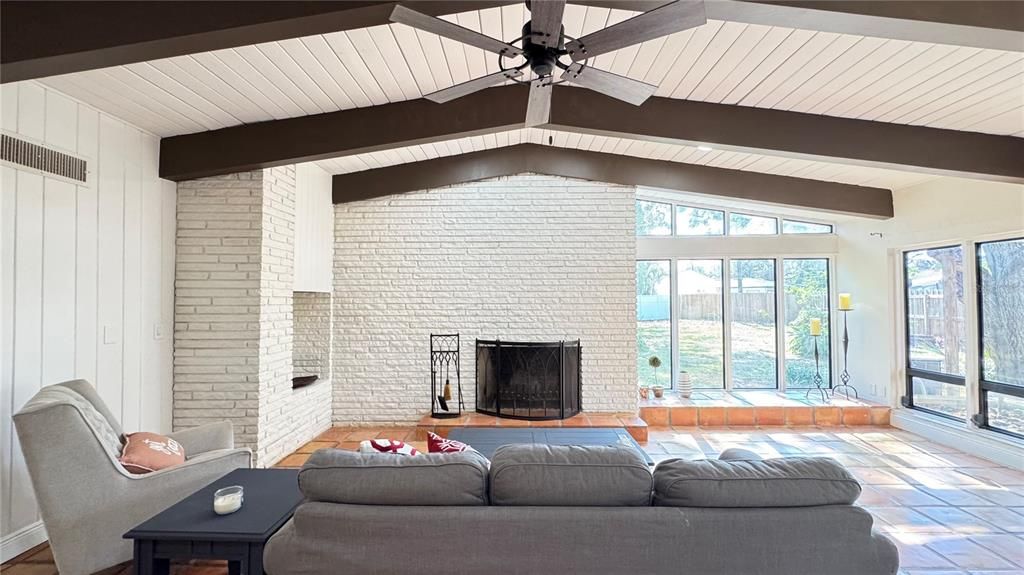 The limestone fireplace is the showstopper in this fantastic open concept living space.