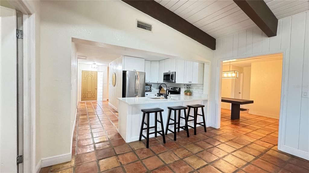 Kitchen offers stainless appliances and quartz countertops.