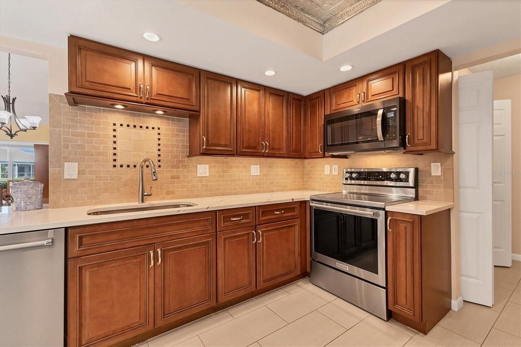 Kitchen W/ Solid wood cabinets, Pot lights & under-counter lighting