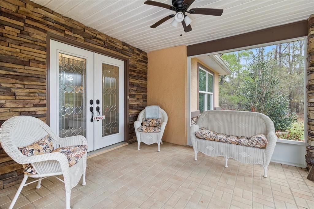 Screened-in lanai at front entrance