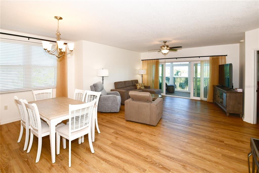 The Great Room opens onto a lanai enclosed with hurricane-impact windows that overlooks Long Bayou.