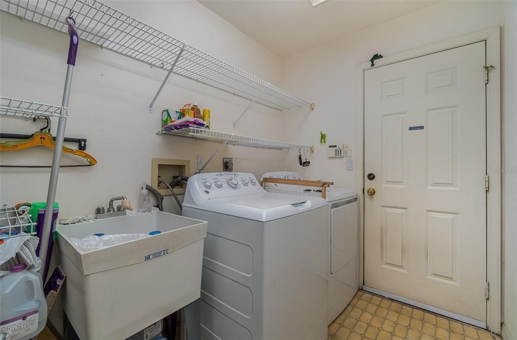 Convenient in-home laundry room with storage space.