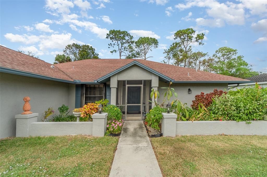 Charming curb appeal with well-maintained landscaping and a welcoming entrance.