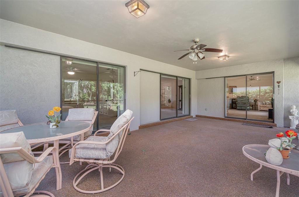 Inviting sunlit Florida room for relaxation and entertainment.