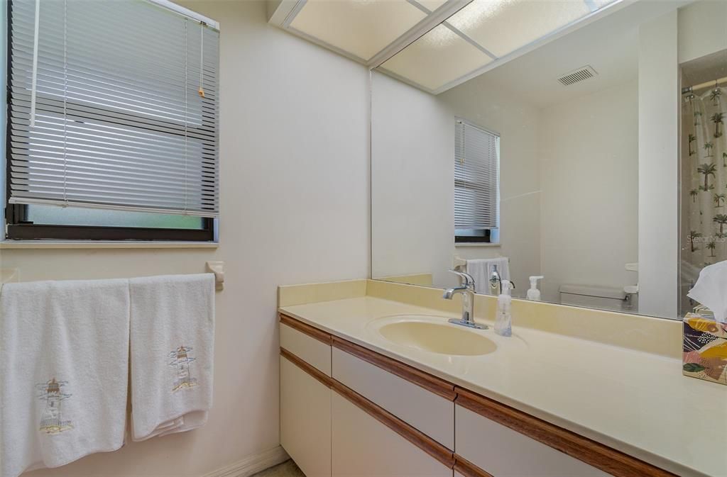 Ample 2nd bathroom with bathtub.