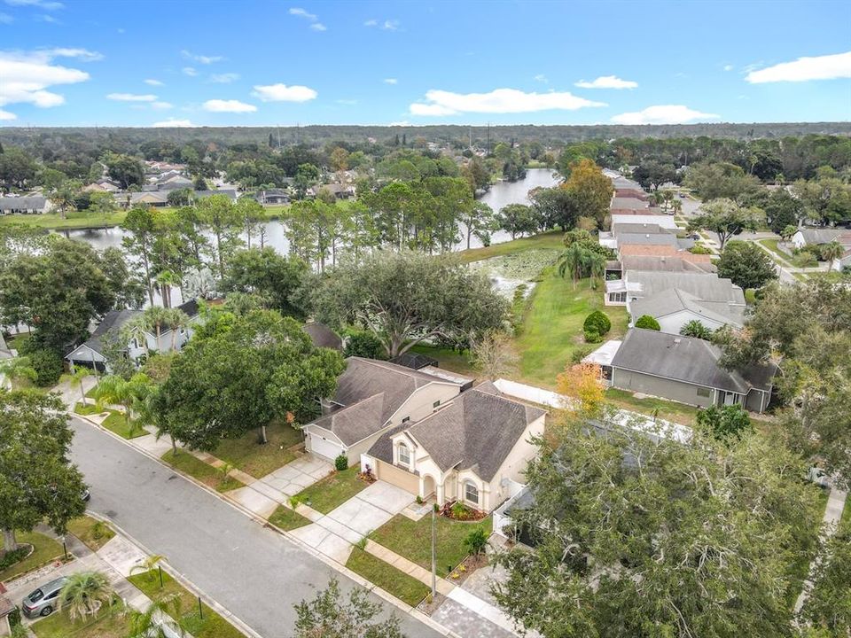 Arial Front with View of Lake and Pond