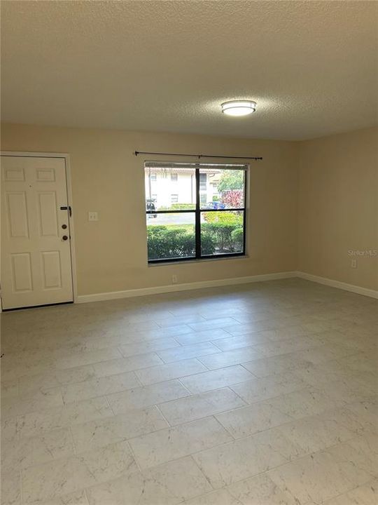 Large window in living area allows for loads of natural light