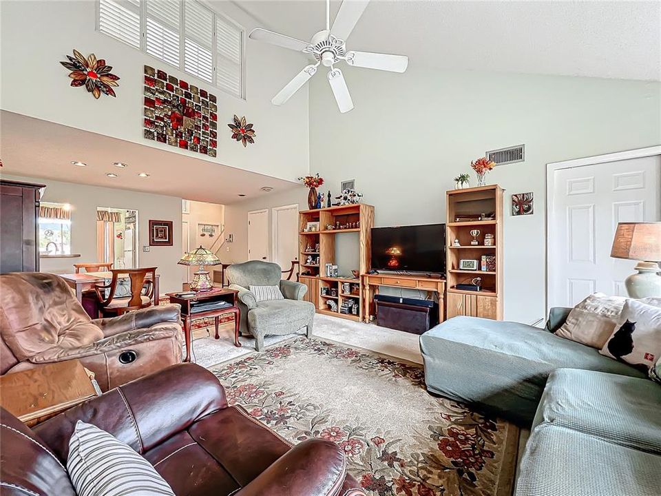 living room and view of upstairs loft/den