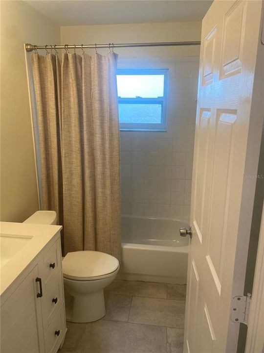 Hall bath with tub shower