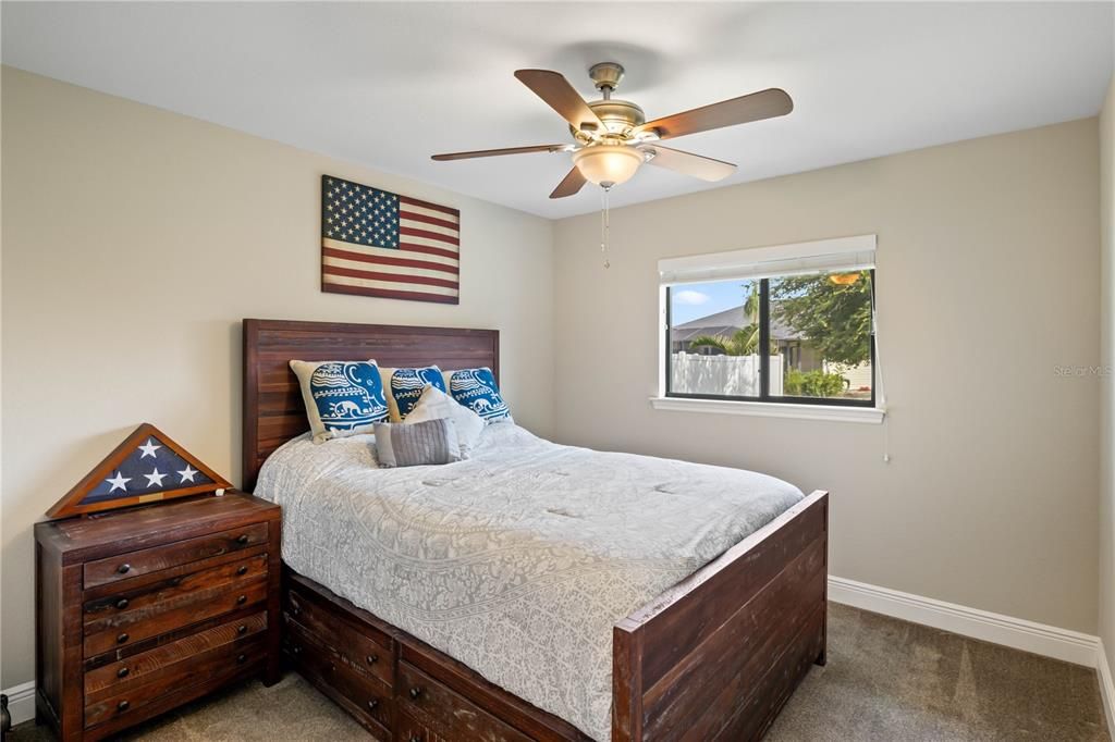 Bedroom with carpet and ceiling fan