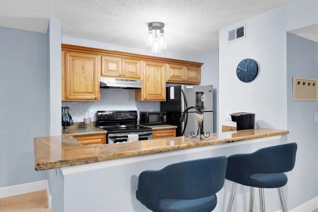 Eat in bar area with granite countertops