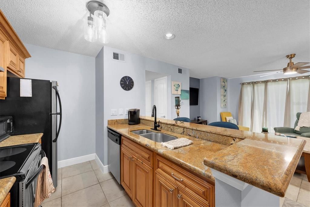 Kitchen and living room both overlooking a long lake view