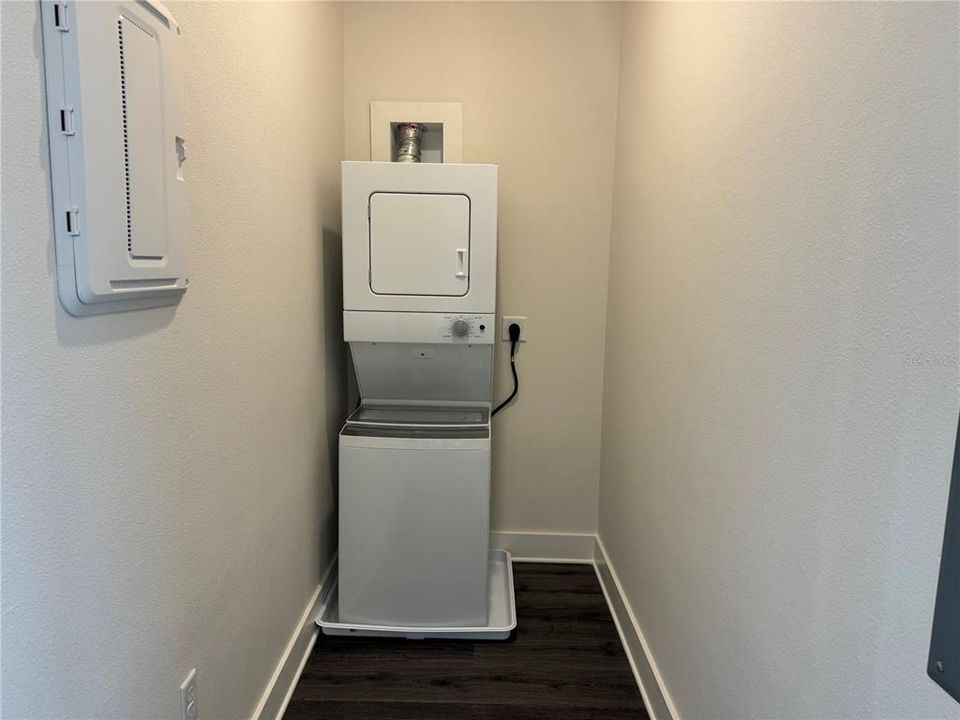 LARGE WALK-IN CLOSET WITH STACKED WASHER/DRYER (PHOTO TAKE PRIOR TO CLOSE SHELVING INSTALLATION)