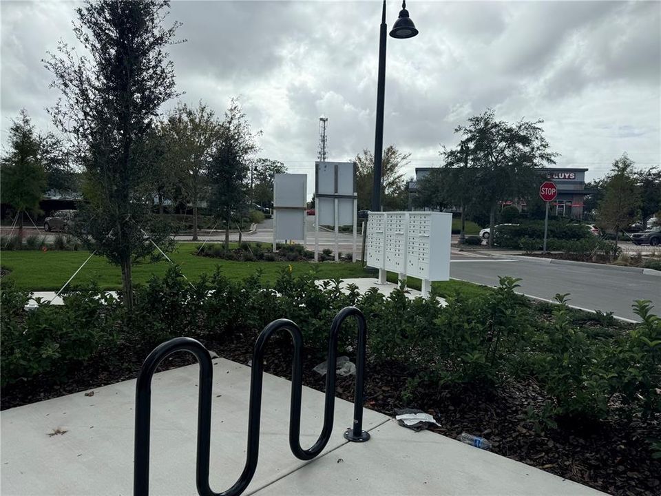 MAILBOX BANK WITH EVERY UNIT WITH PRIVATE BOX, BIKE RACKS, EV CHARGING STATIONS, PARKING GALORE!