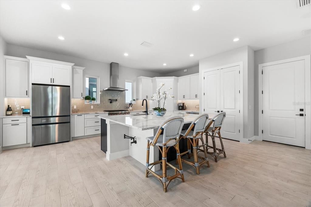 Spacious kitchen with plenty of counter space, cabinets, and natural light.