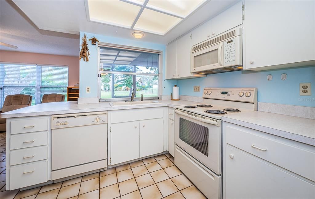 Kitchen with pass thru window to lanai