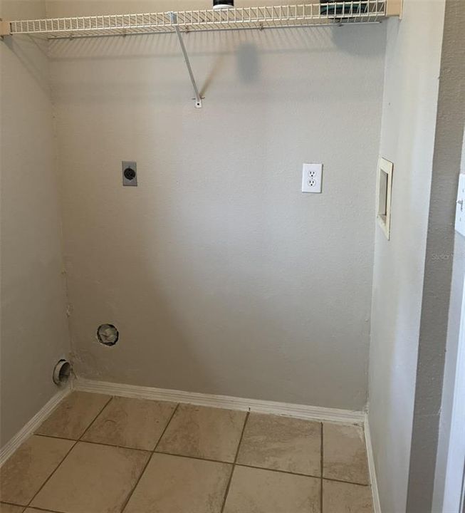 Large inside laundry room with more storage